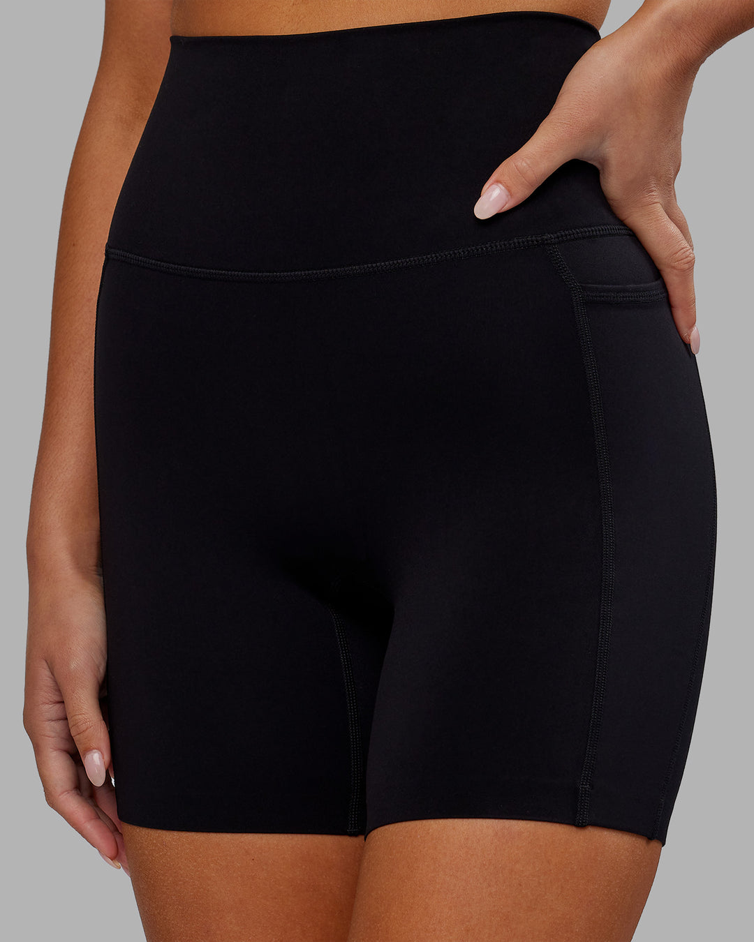 Woman wearing Elixir Ultra High-Rise 6&quot; Short Pockets - Black | Model:Kirstyn | Size:S