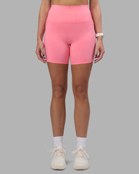 Woman wearing Elixir Ultra High-Rise 6" Short Pockets - Candy Pink | Model:Phoebe | Size:S