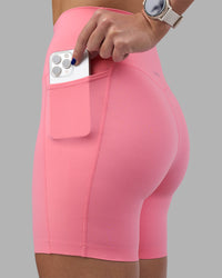 Woman wearing Elixir Ultra High-Rise 6" Short Pockets - Candy Pink | Model:Phoebe | Size:S