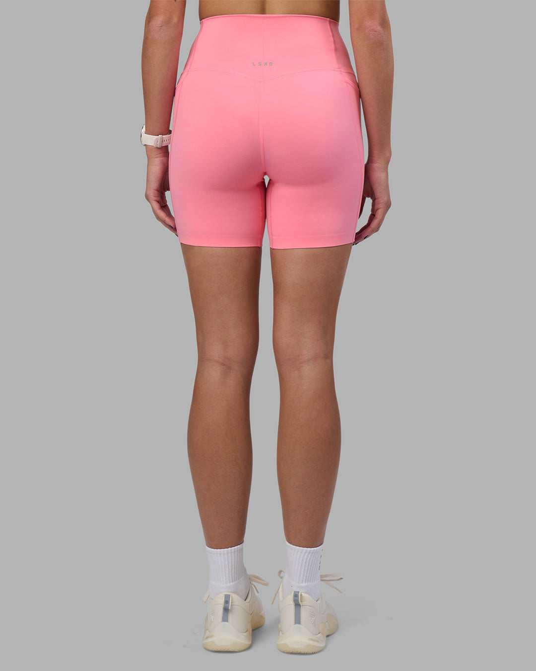 Woman wearing Elixir Ultra High-Rise 6&quot; Short Pockets - Candy Pink | Model:Phoebe | Size:S