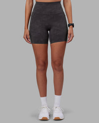 Woman wearing Elixir Ultra High-Rise 6" Short Pockets - Dark Storm Wash | Model:Rhiley | Size:S
