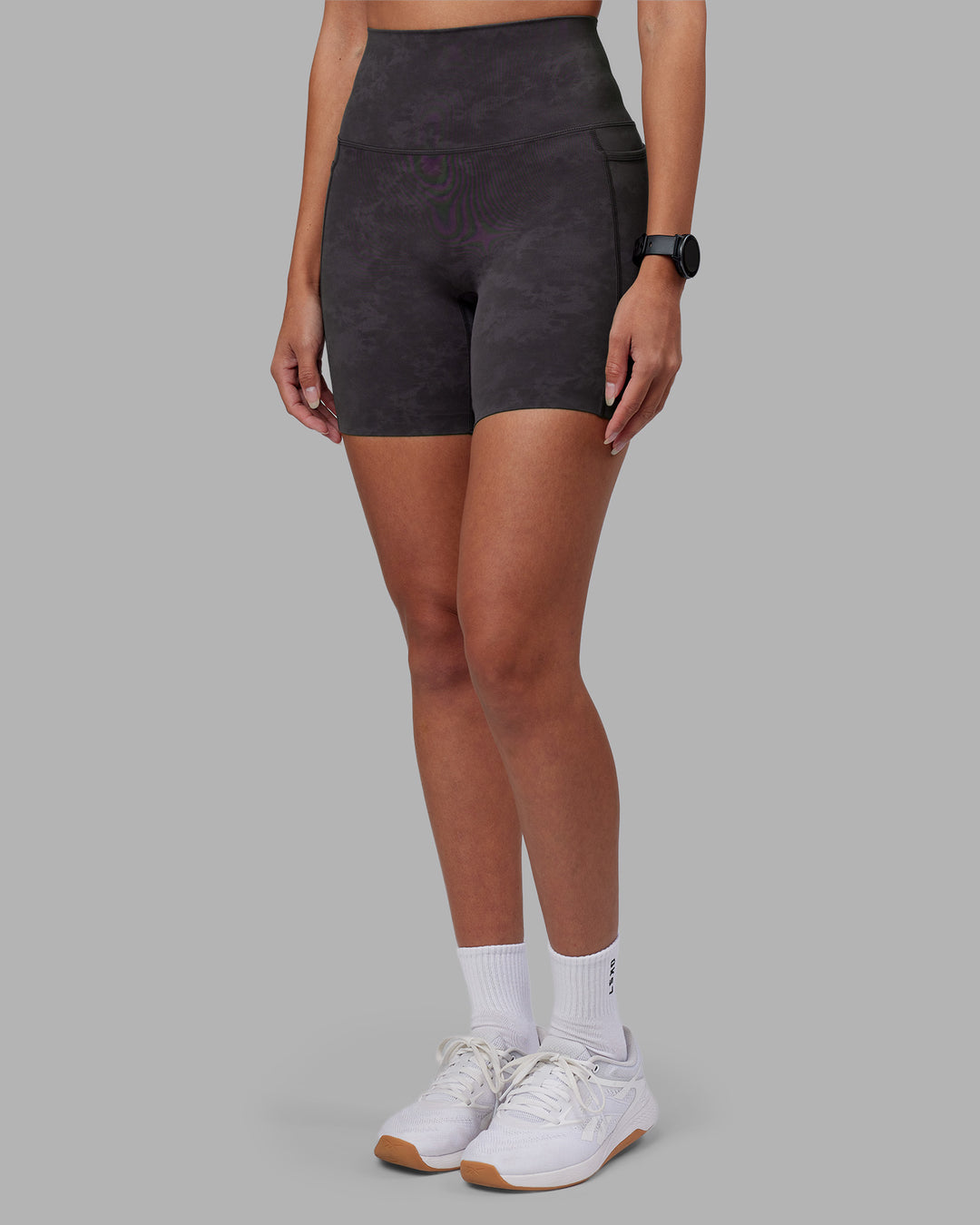 Woman wearing Elixir Ultra High-Rise 6&quot; Short Pockets - Dark Storm Wash | Model:Rhiley | Size:S