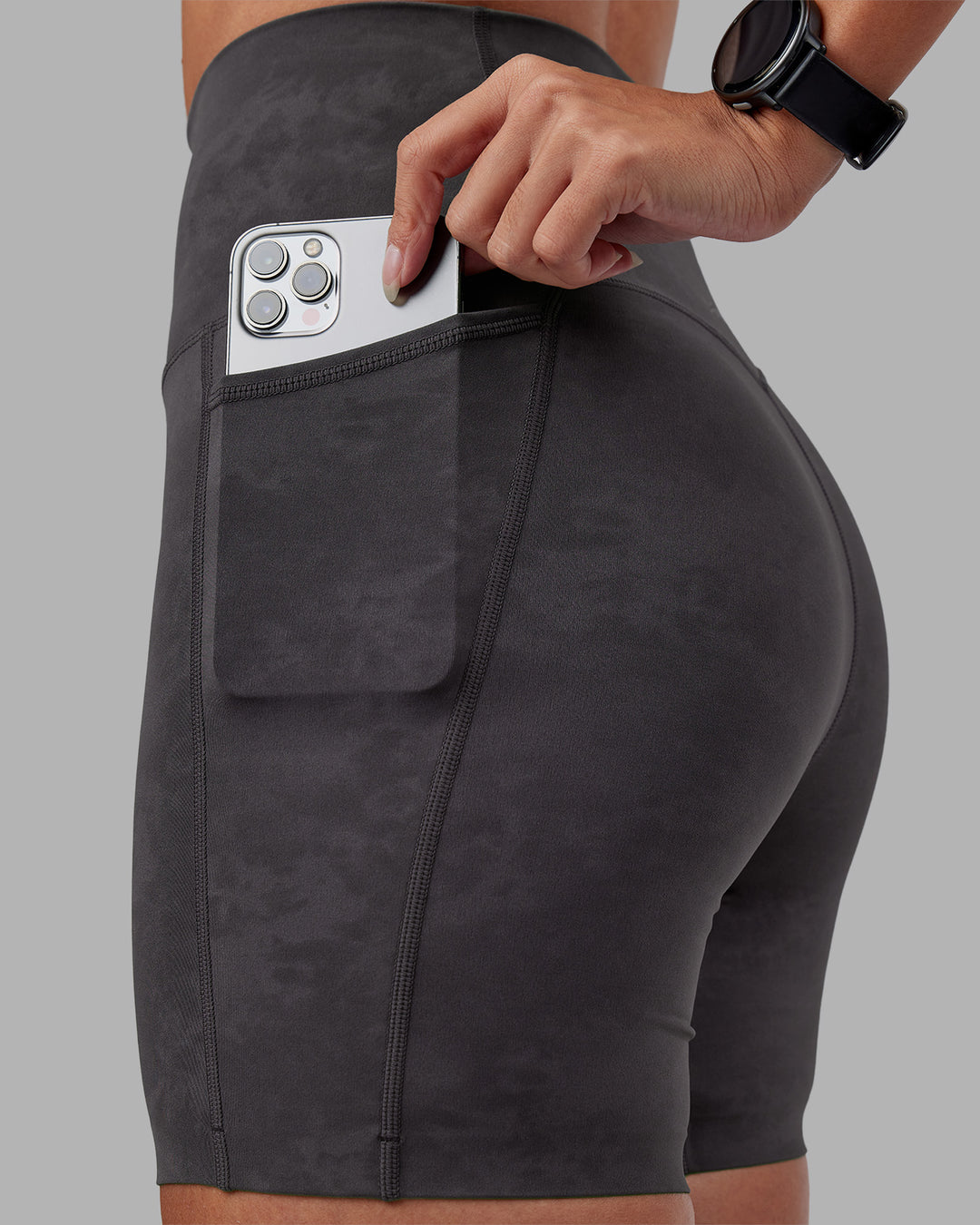 Woman wearing Elixir Ultra High-Rise 6" Short Pockets - Dark Storm Wash | Model:Rhiley | Size:S