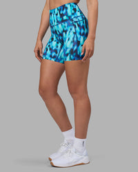 Woman wearing Elixir Ultra High-Rise 6" Short Pockets - Luminous | Model:Sophie | Size:S