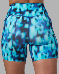 Woman wearing Elixir Ultra High-Rise 6" Short Pockets - Luminous | Model:Sophie | Size:S