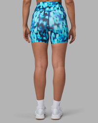 Woman wearing Elixir Ultra High-Rise 6" Short Pockets - Luminous | Model:Sophie | Size:S