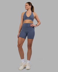 Woman wearing Elixir Ultra High-Rise 6" Short Pockets - Night Shadow | Model:Phoebe | Size:S