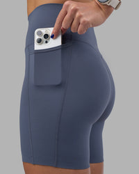 Woman wearing Elixir Ultra High-Rise 6" Short Pockets - Night Shadow | Model:Phoebe | Size:S
