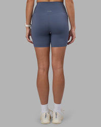 Woman wearing Elixir Ultra High-Rise 6" Short Pockets - Night Shadow | Model:Phoebe | Size:S