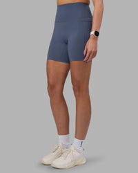 Woman wearing Elixir Ultra High-Rise 6" Short Pockets - Night Shadow | Model:Phoebe | Size:S