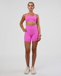Woman wearing Elixir Ultra High-Rise 6" Short - Ultra Fuchsia | Model:Myrte | Size:S