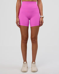 Woman wearing Elixir Ultra High-Rise 6" Short - Ultra Fuchsia | Model:Myrte | Size:S
