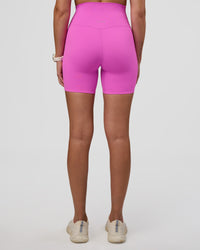Woman wearing Elixir Ultra High-Rise 6" Short - Ultra Fuchsia | Model:Myrte | Size:S