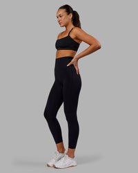 Woman wearing Elixir Ultra High-Rise 7/8 Legging - Black | Model:Kirstyn | Size:S