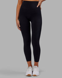 Woman wearing Elixir Ultra High-Rise 7/8 Legging - Black | Model:Kirstyn | Size:S