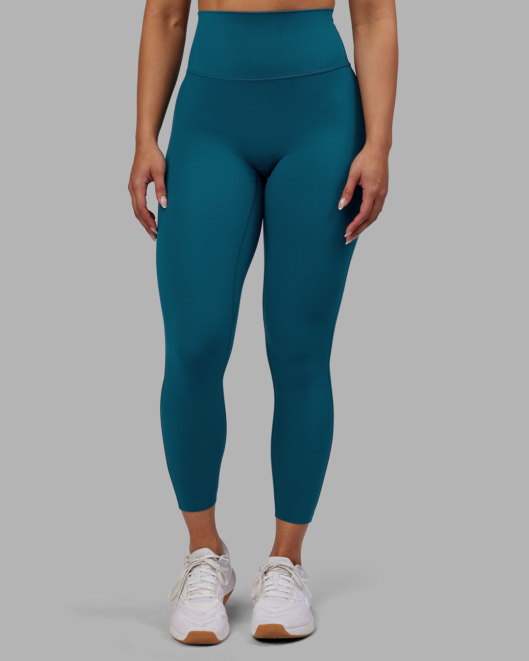 Woman wearing Elixir Ultra High-Rise 7/8 Legging - Blue Coral | Model:Ayla | Size:S