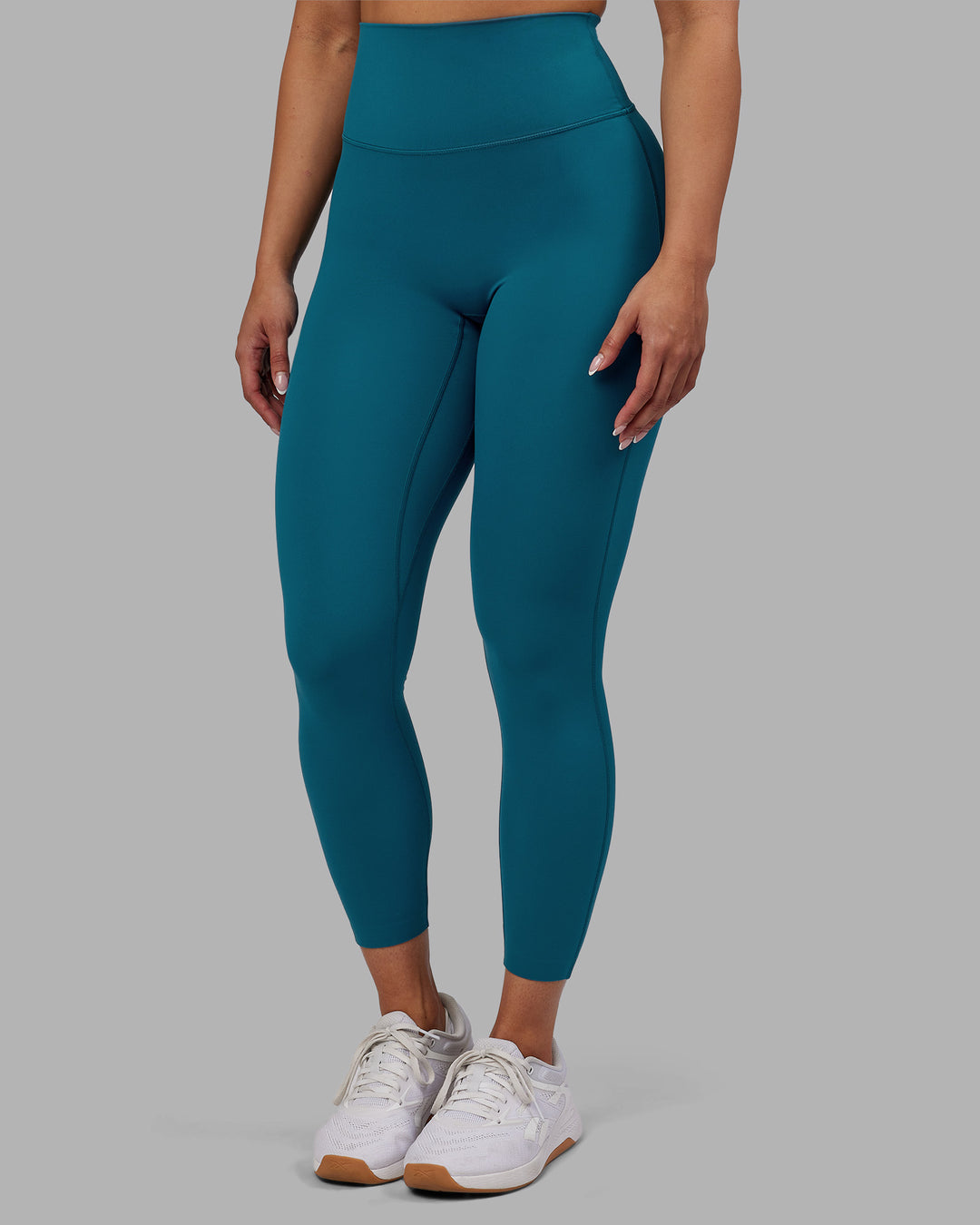 Woman wearing Elixir Ultra High-Rise 7/8 Legging - Blue Coral | Model:Ayla | Size:S