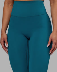 Woman wearing Elixir Ultra High-Rise 7/8 Legging - Blue Coral | Model:Ayla | Size:S