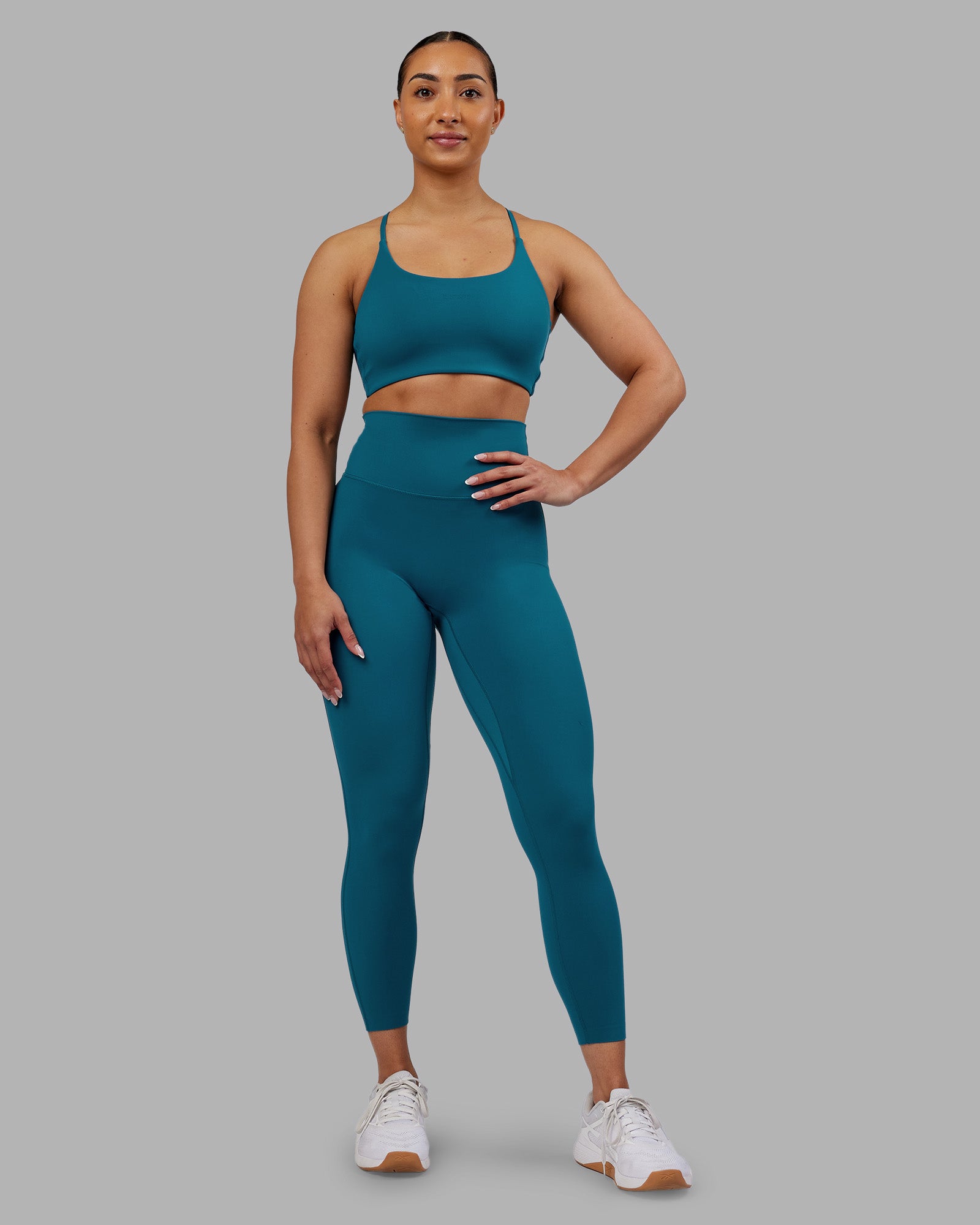 Woman wearing Elixir Ultra High-Rise 7/8 Legging - Blue Coral | Model:Ayla | Size:S