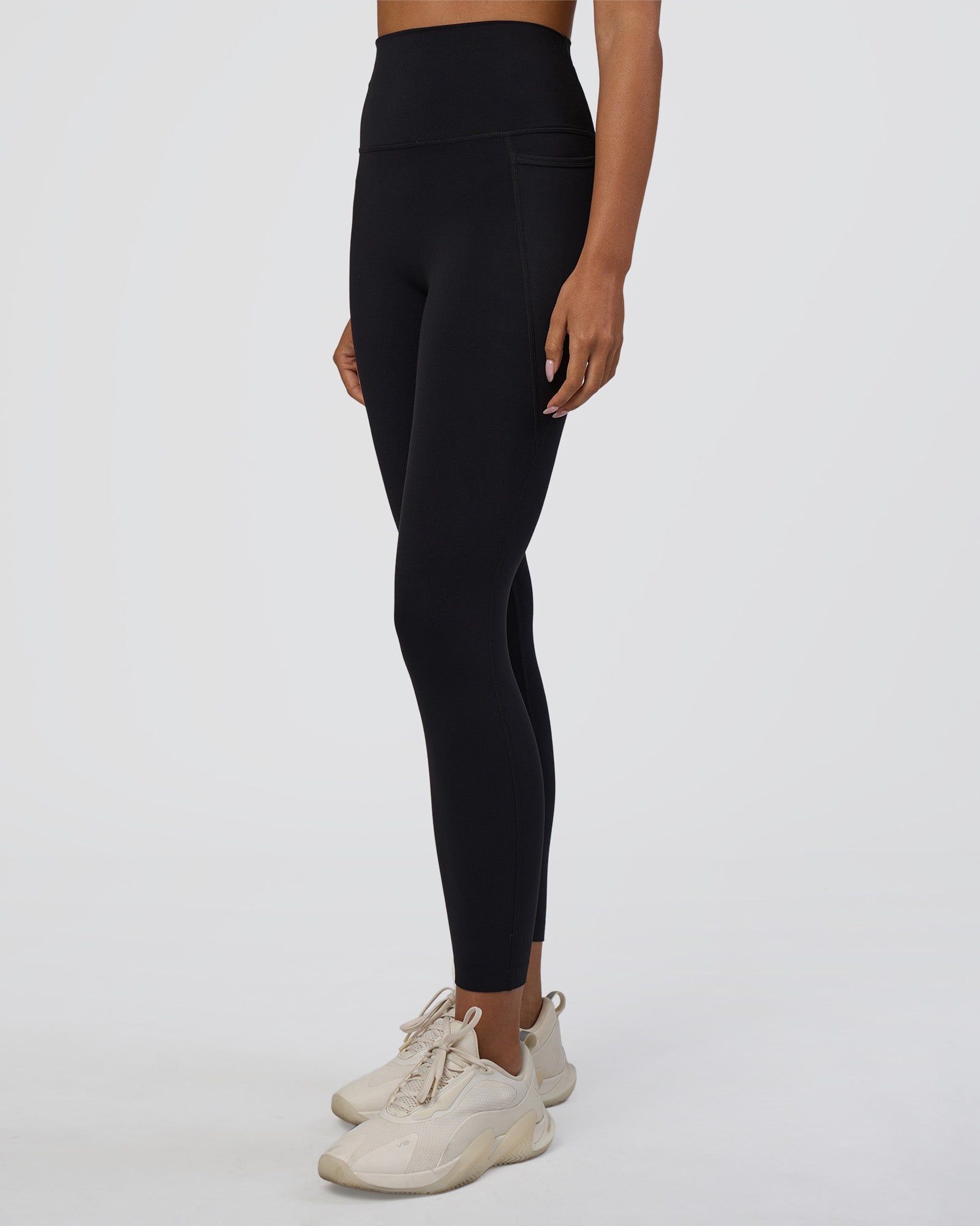 Woman wearing Elixir Ultra High-Rise 7/8 Legging Pockets - Black | Model:Ruby | Size:S