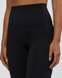 Woman wearing Elixir Ultra High-Rise 7/8 Legging Pockets - Black | Model:Ruby | Size:S