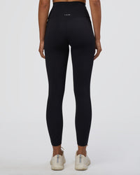 Woman wearing Elixir Ultra High-Rise 7/8 Legging Pockets - Black | Model:Ruby | Size:S