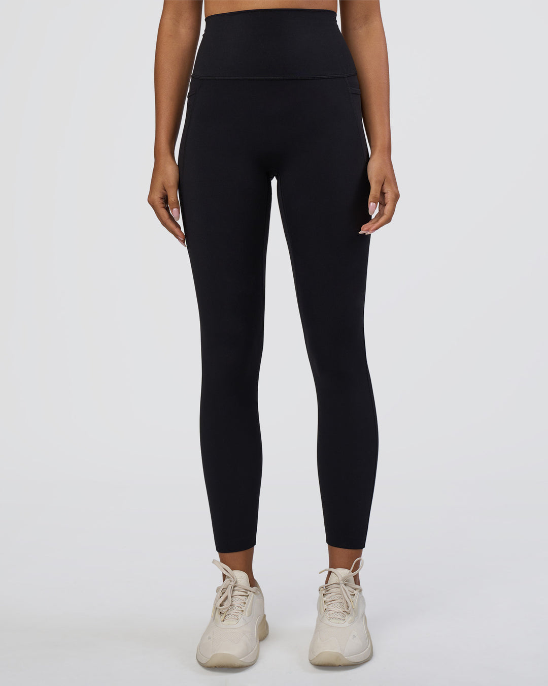 Woman wearing Elixir Ultra High-Rise 7/8 Legging Pockets - Black | Model:Ruby | Size:S
