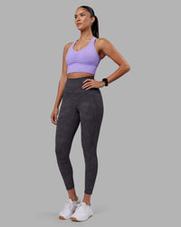 Woman wearing Elixir Ultra High-Rise 7/8 Legging Pockets - Dark Storm Wash | Model:Rhiley | Size:S