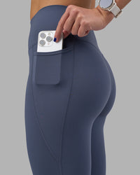 Woman wearing Elixir Ultra High-Rise 7/8 Legging Pockets - Night Shadow | Model:Phoebe | Size:S