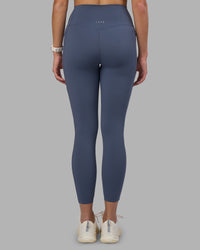Woman wearing Elixir Ultra High-Rise 7/8 Legging Pockets - Night Shadow | Model:Phoebe | Size:S