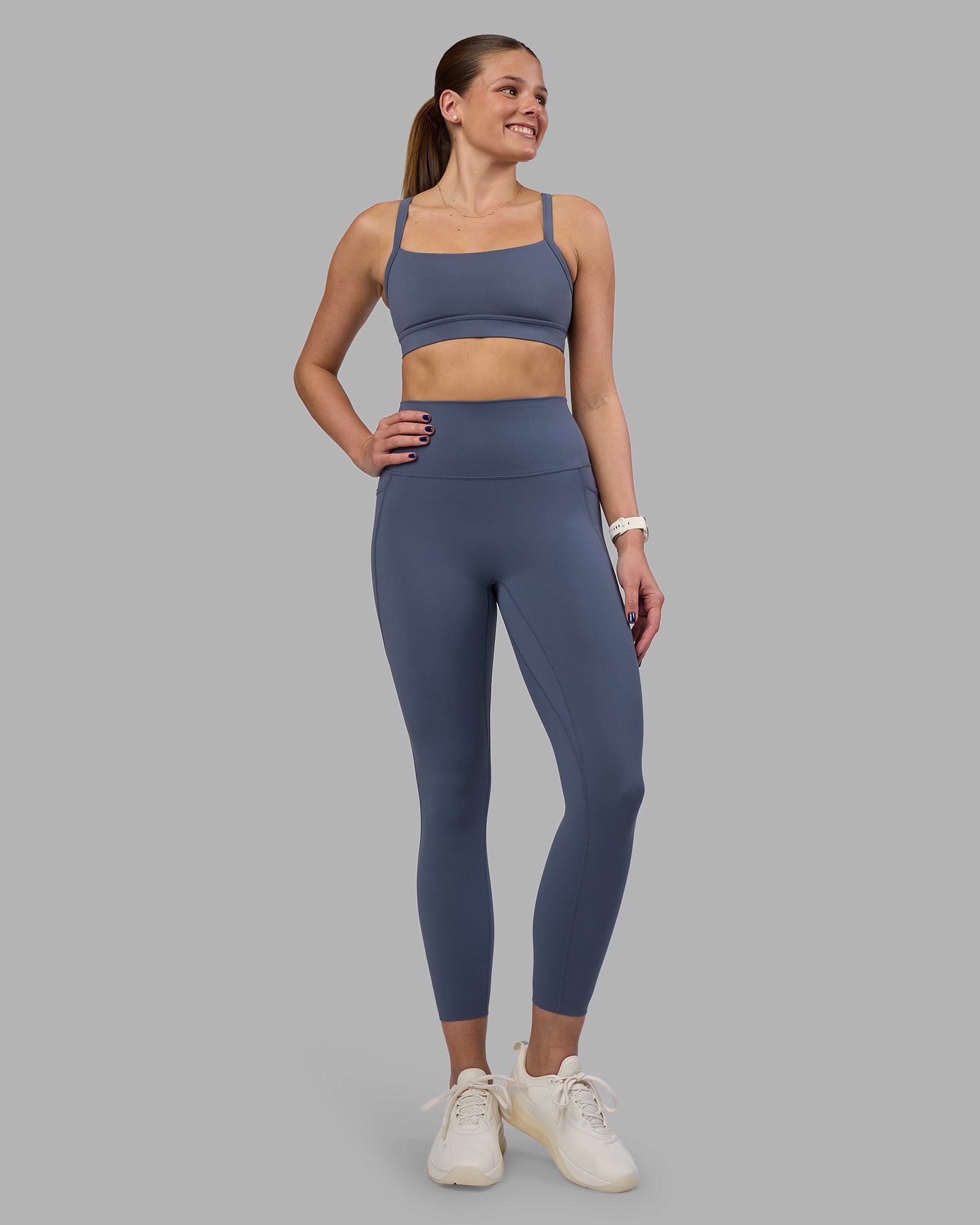 Woman wearing Elixir Ultra High-Rise 7/8 Legging Pockets - Night Shadow | Model:Phoebe | Size:S