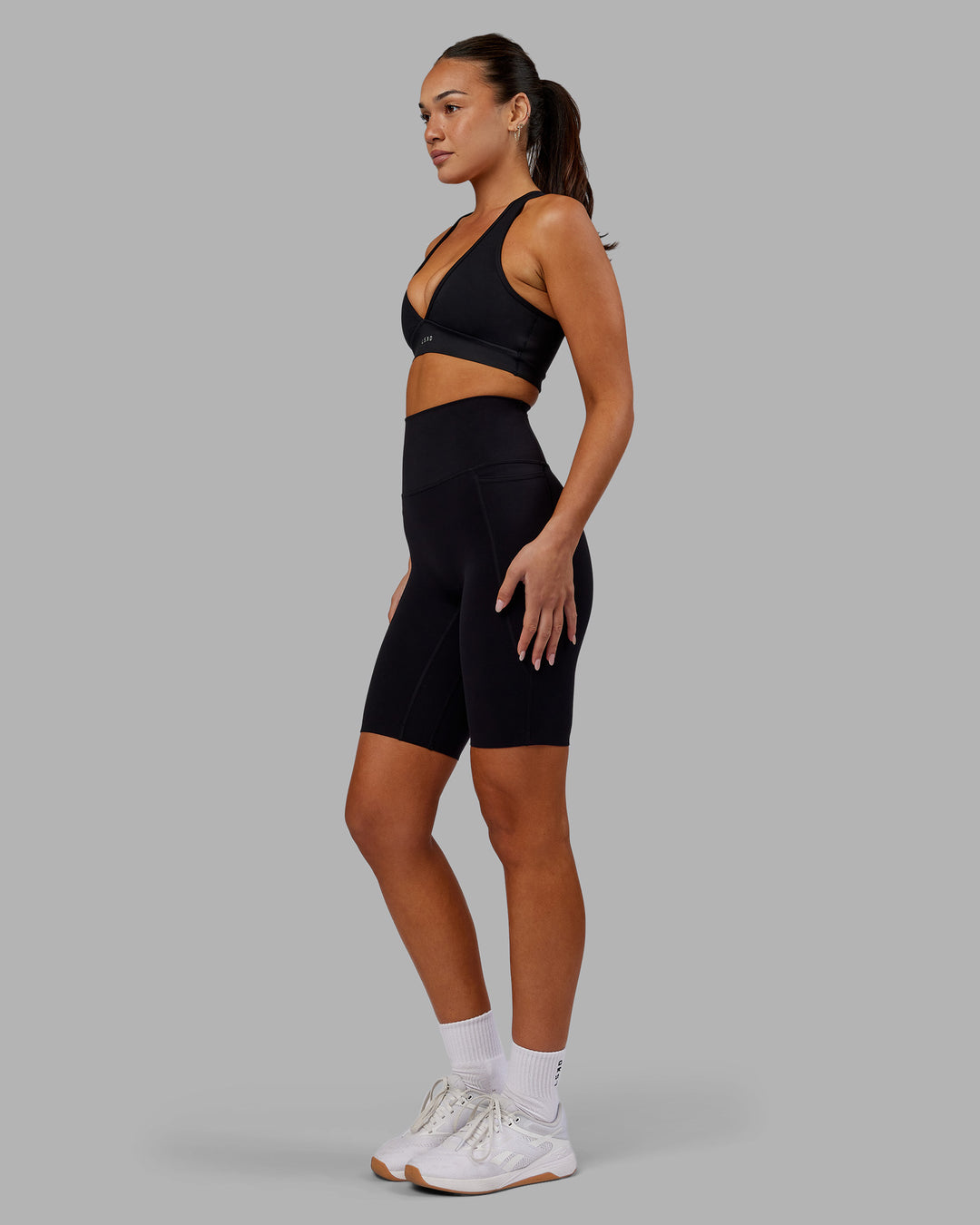 Woman wearing Elixir Ultra High-Rise 9&quot; Short Pockets - Black | Model:Kirstyn | Size:S