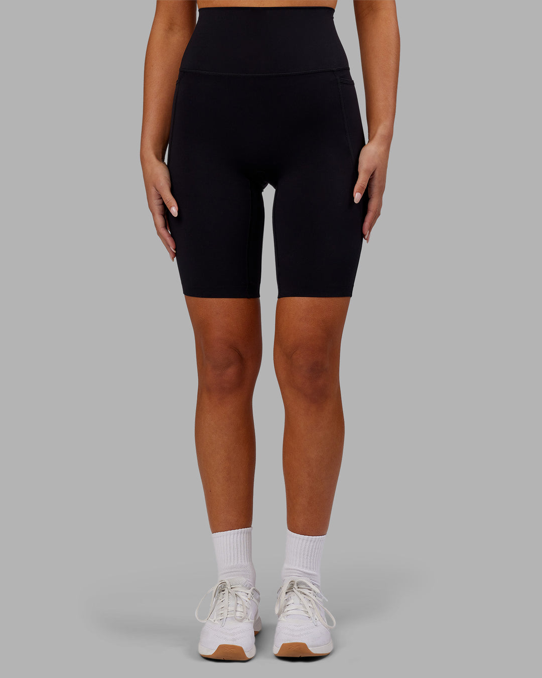 Woman wearing Elixir Ultra High-Rise 9&quot; Short Pockets - Black | Model:Kirstyn | Size:S