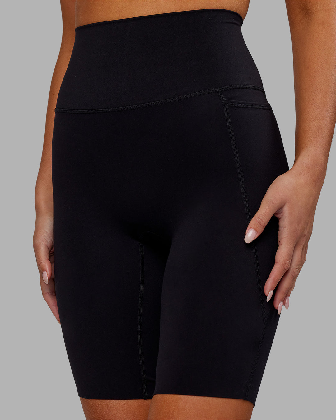 Woman wearing Elixir Ultra High-Rise 9&quot; Short Pockets - Black | Model:Kirstyn | Size:S