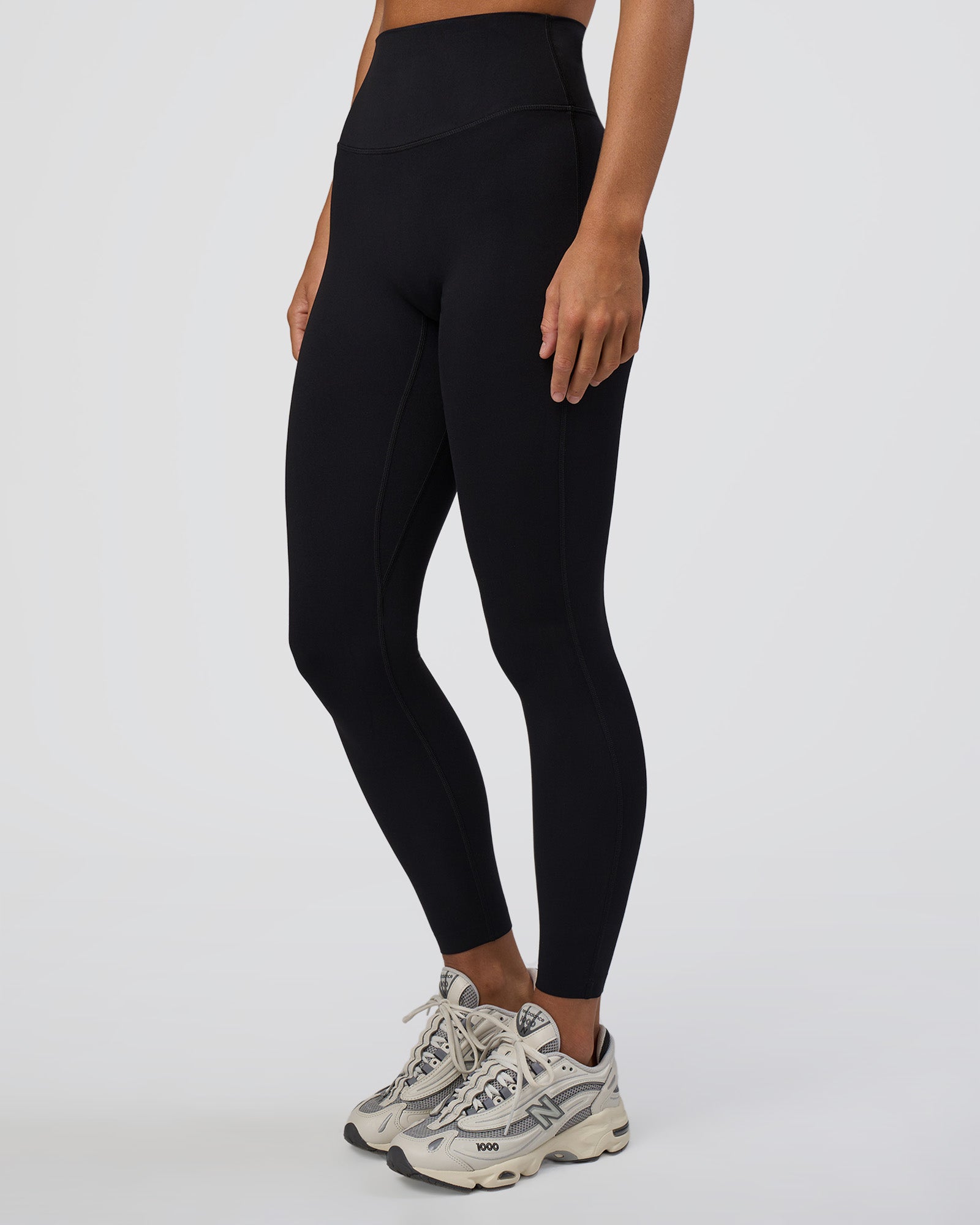 Woman wearing Elixir Ultra High-Rise Full Length Legging - Black | Model:Amity | Size:S