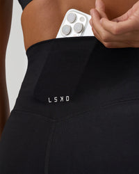 Woman wearing Elixir Ultra High-Rise Full Length Legging - Black | Model:Amity | Size:S