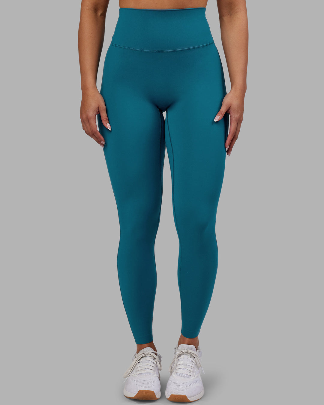 Woman wearing Elixir Ultra High-Rise Full Length Legging - Blue Coral | Model:Ayla | Size:S
