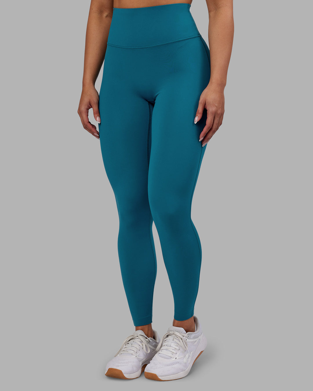 Woman wearing Elixir Ultra High-Rise Full Length Legging - Blue Coral | Model:Ayla | Size:S