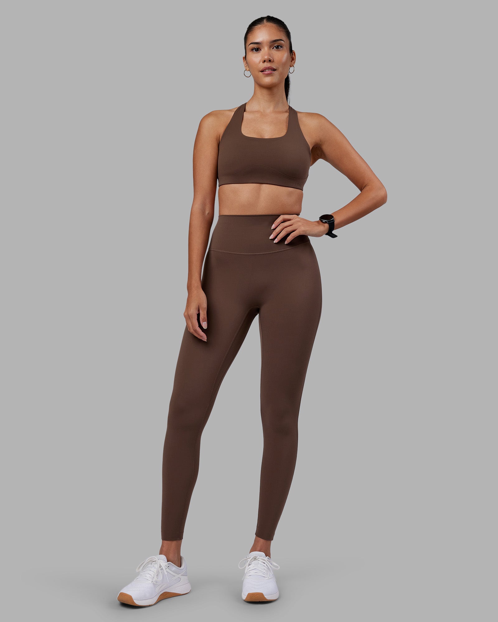 Woman wearing Elixir Ultra High-Rise Full Length Legging - Chocolate Martini | Model:Rhiley | Size:S