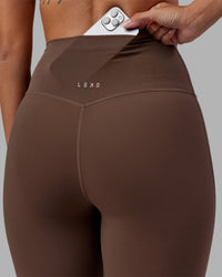 Woman wearing Elixir Ultra High-Rise Full Length Legging - Chocolate Martini | Model:Rhiley | Size:S