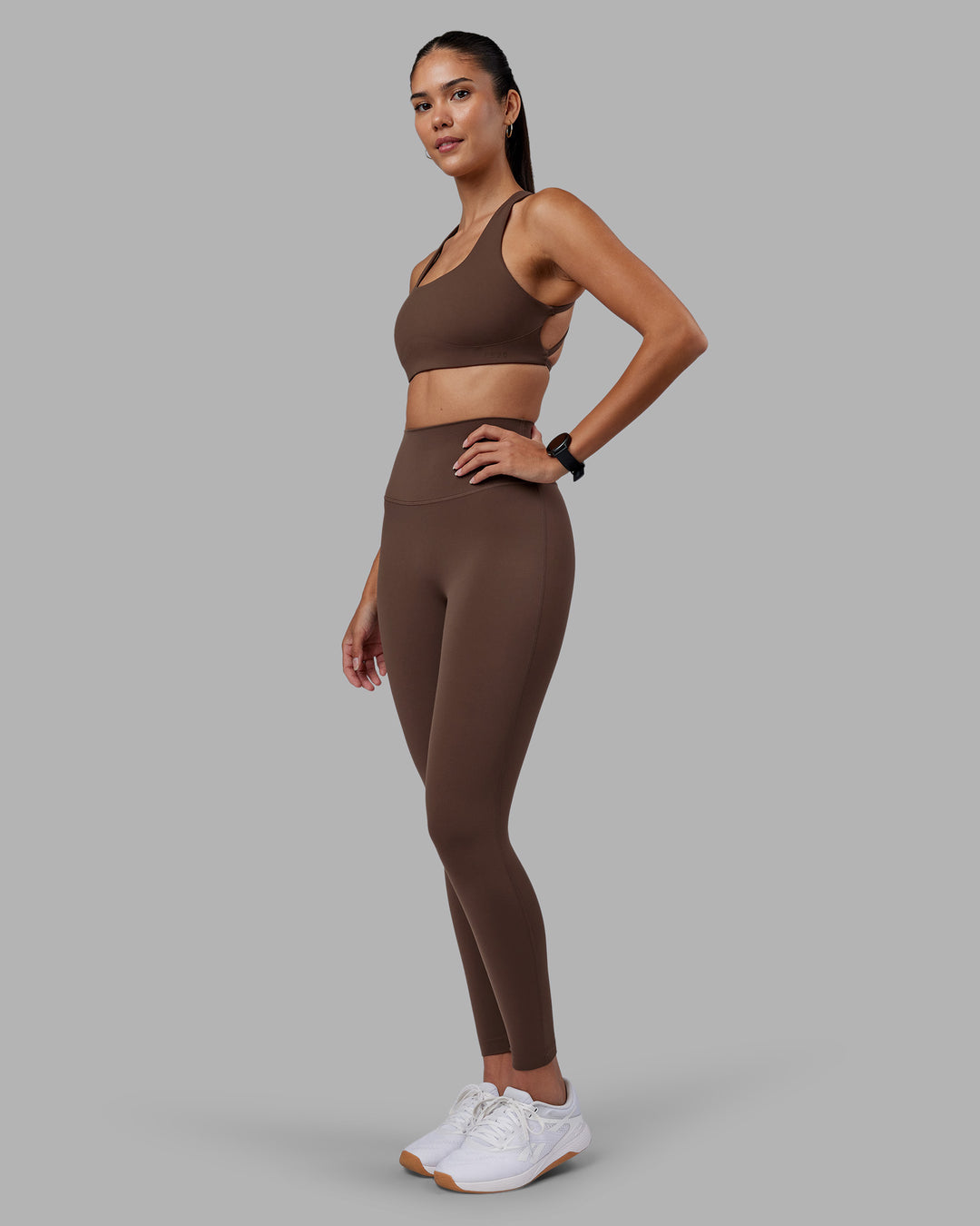 Woman wearing Elixir Ultra High-Rise Full Length Legging - Chocolate Martini | Model:Rhiley | Size:S