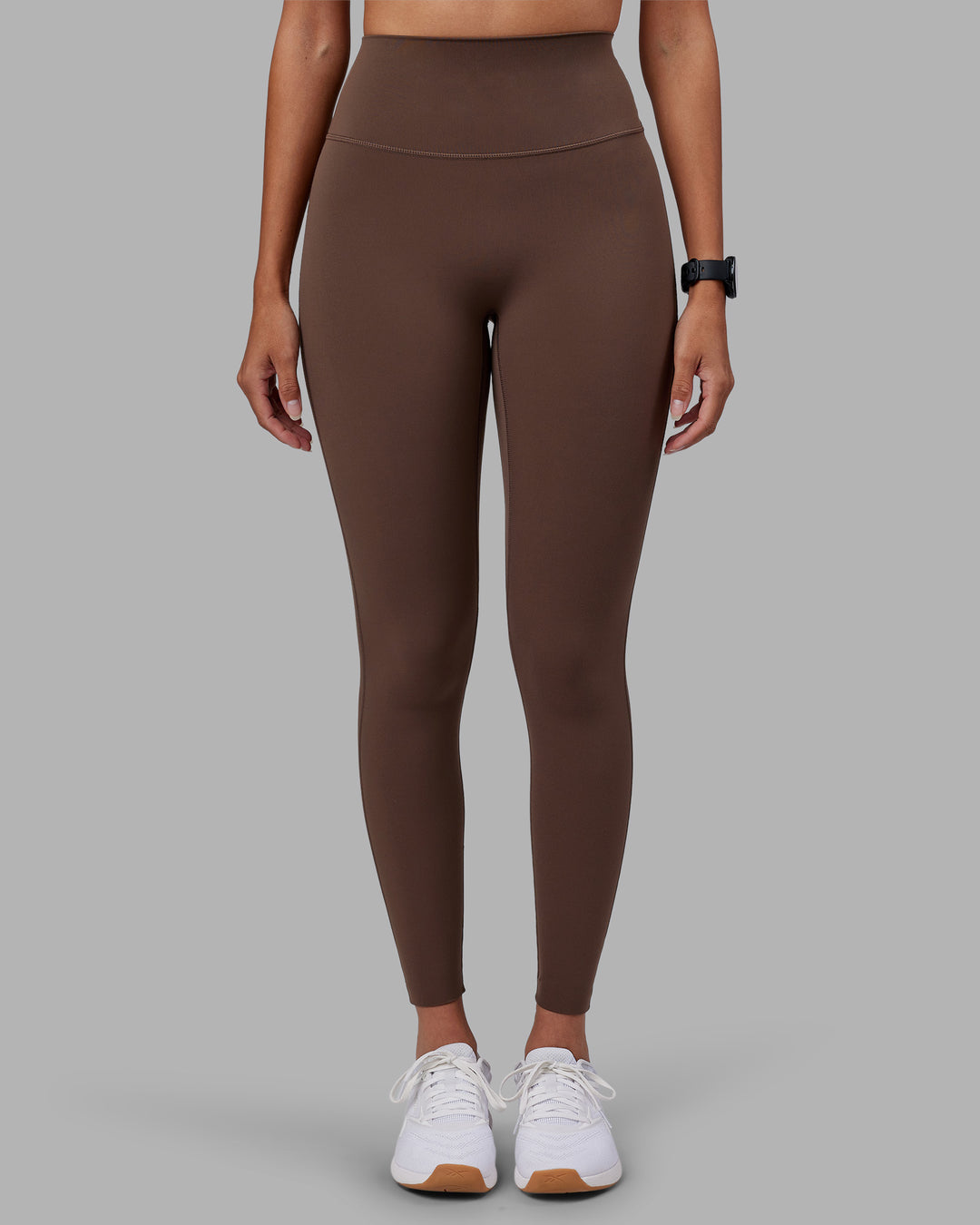 Woman wearing Elixir Ultra High-Rise Full Length Legging - Chocolate Martini | Model:Rhiley | Size:S