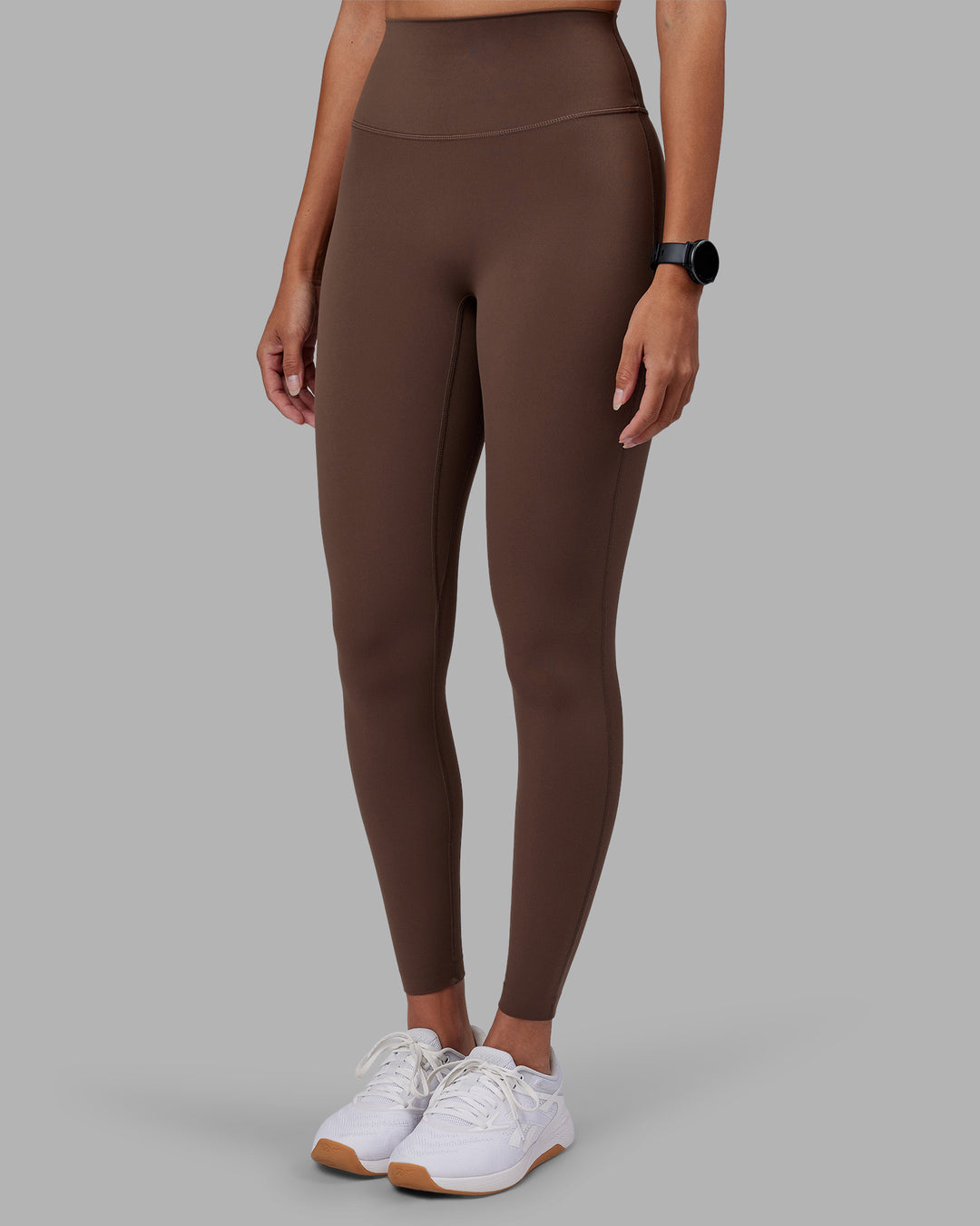 Woman wearing Elixir Ultra High-Rise Full Length Legging - Chocolate Martini | Model:Rhiley | Size:S