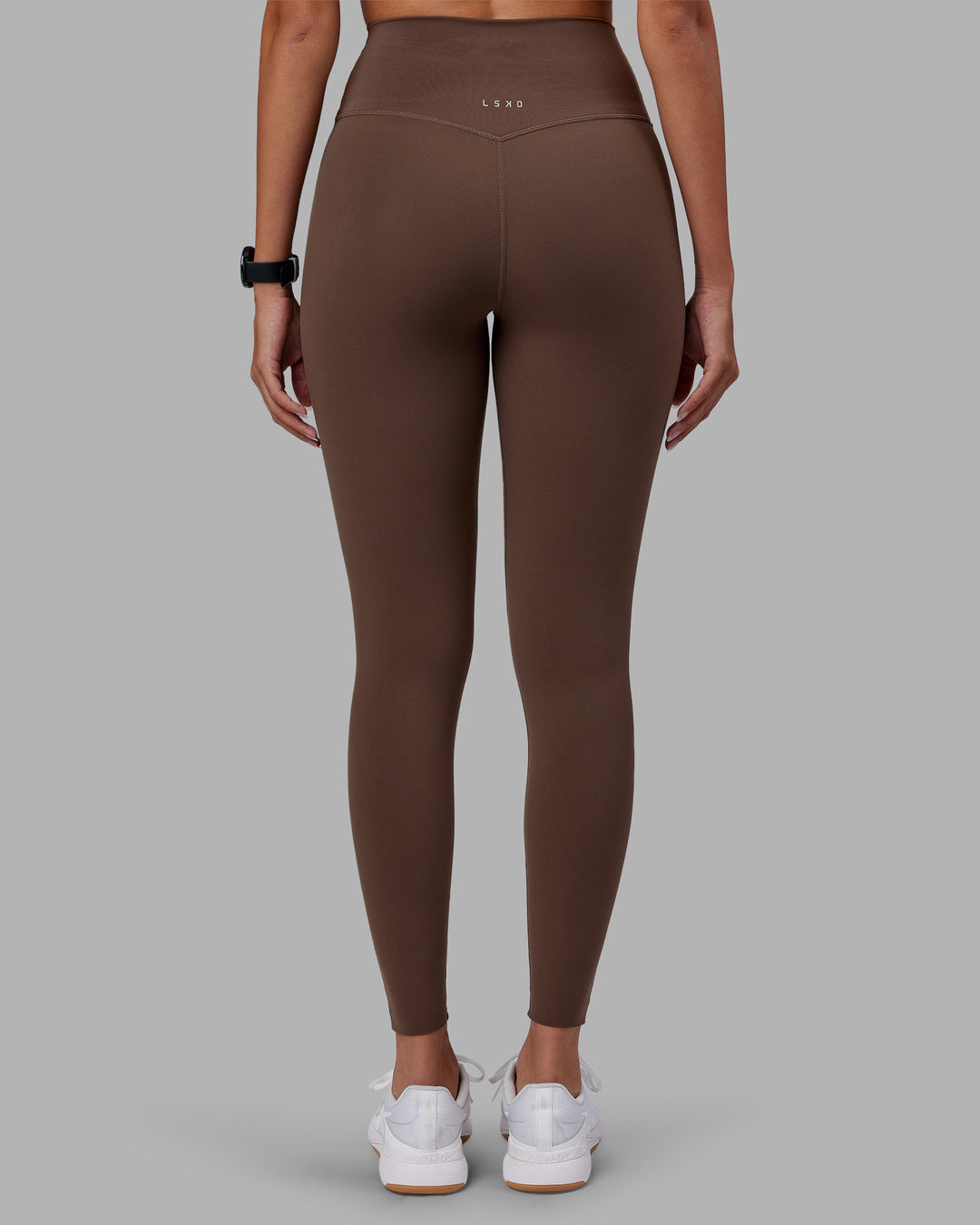 Woman wearing Elixir Ultra High-Rise Full Length Legging - Chocolate Martini | Model:Rhiley | Size:S