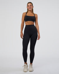 Woman wearing Elixir Ultra High-Rise Full Length Legging Pockets - Black | Model:Amity | Size:S