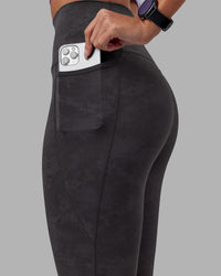 Woman wearing Elixir Ultra High-Rise Full Length Legging Pockets - Dark Storm Wash | Model:Rhiley | Size:S