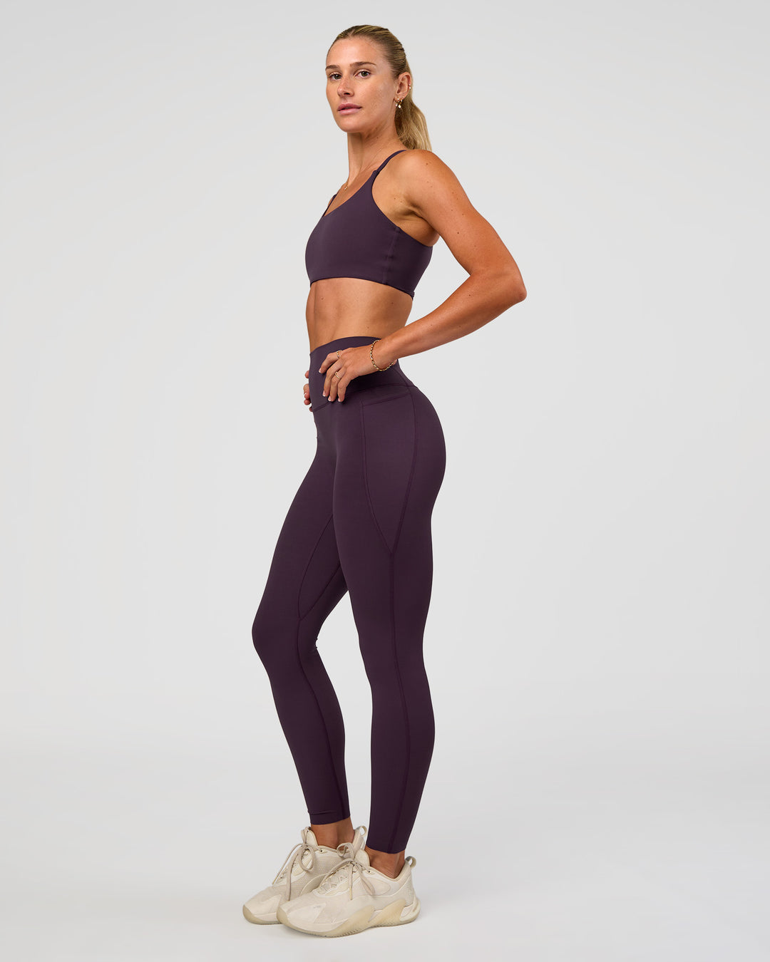 Woman wearing Elixir Ultra High-Rise Full Length Legging Pockets - Midnight Plum | Model:Emelia | Size:S