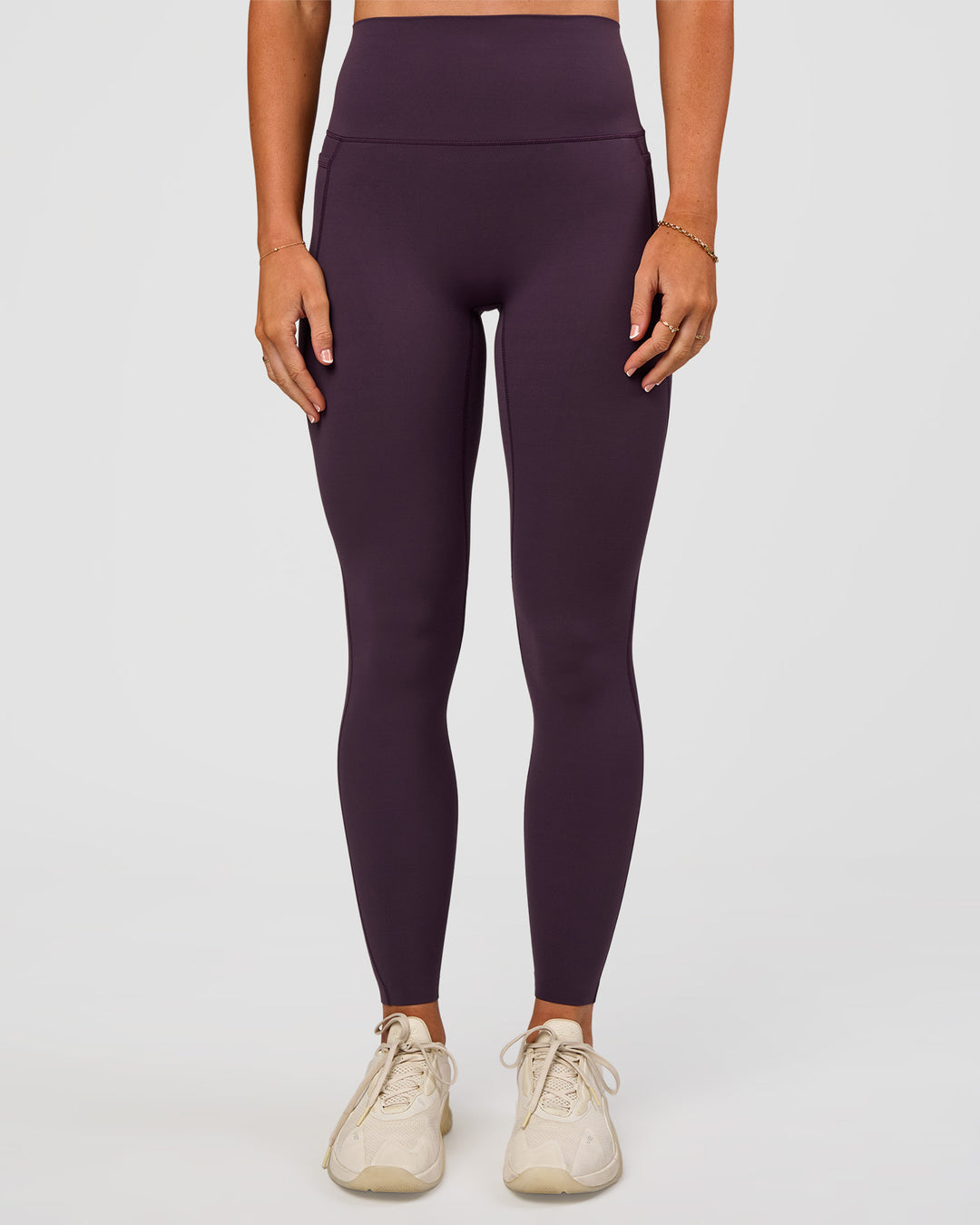 Woman wearing Elixir Ultra High-Rise Full Length Legging Pockets - Midnight Plum | Model:Emelia | Size:S