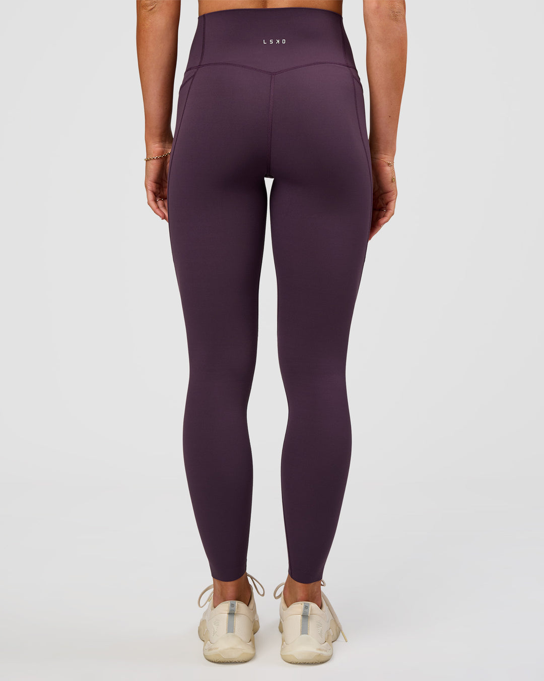 Woman wearing Elixir Ultra High-Rise Full Length Legging Pockets - Midnight Plum | Model:Emelia | Size:S