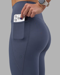 Woman wearing Elixir Ultra High-Rise Full Length Legging Pockets - Night Shadow | Model:Phoebe | Size:S